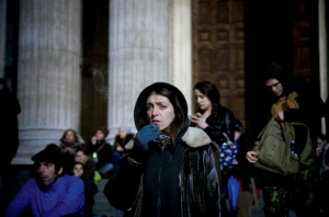Credit: Brian Leli (October 2011: Occupy London: a woman smokes a cigarette at the steps to St Paul’s Cathedral.)